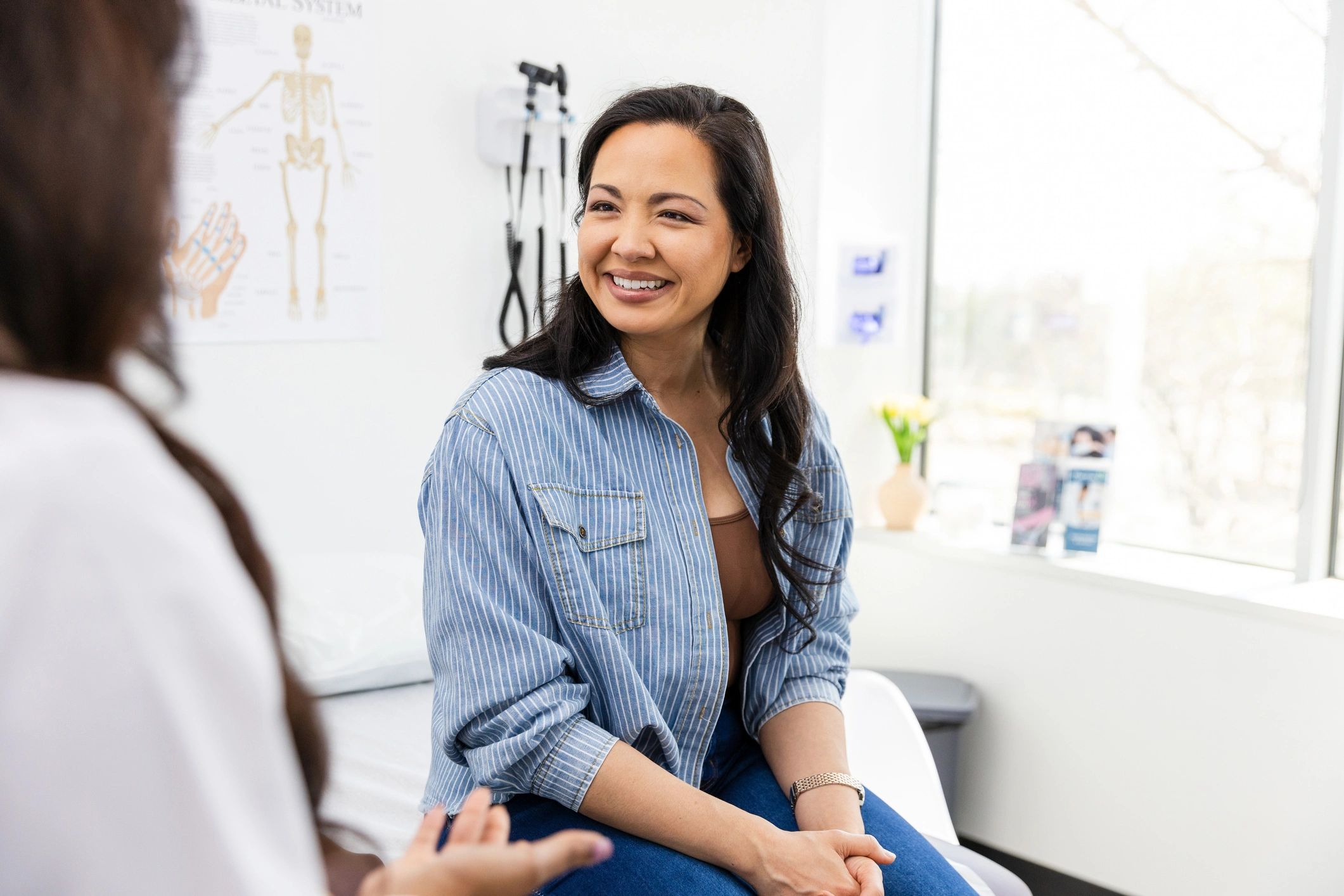 Patient smiling during a clinic consultation