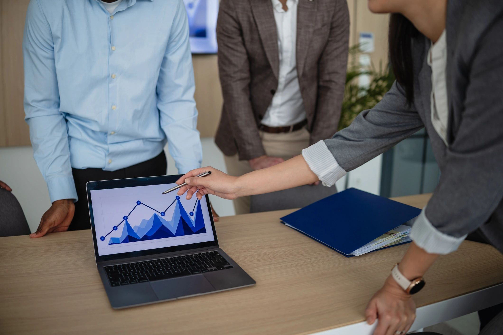 Professionals reviewing analytics on a tablet