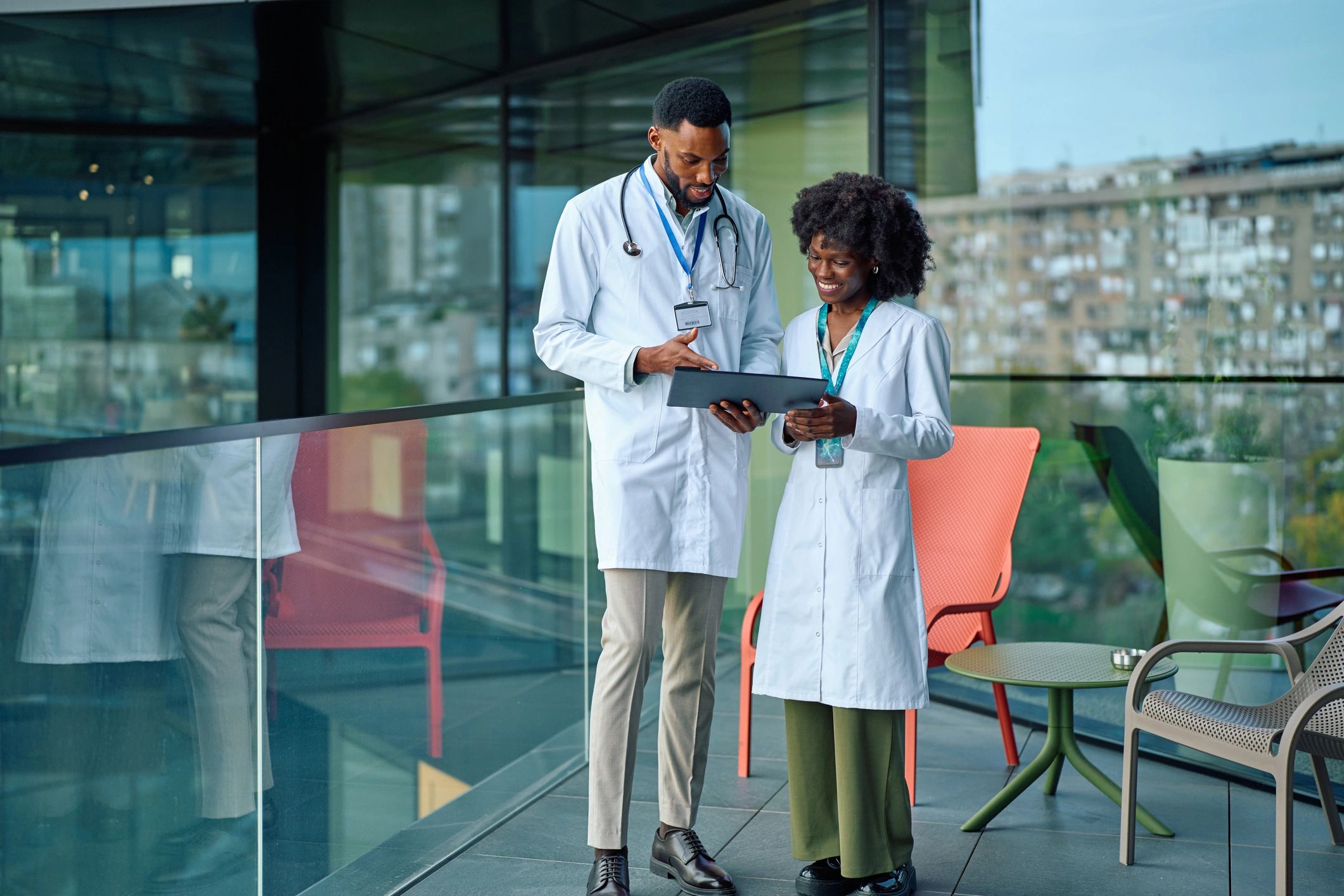Doctors collaborating and reviewing information on a tablet